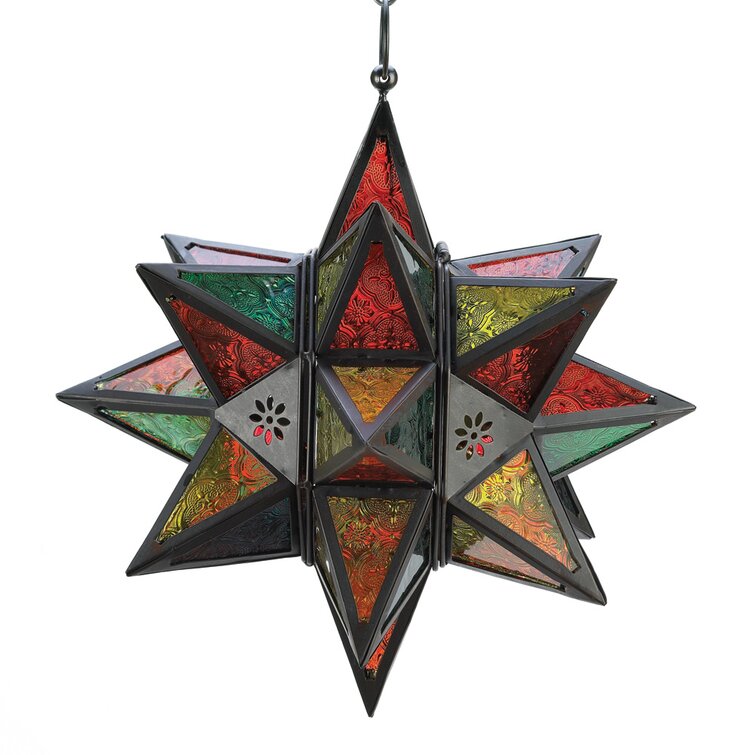 The jewel tone pressed glass panels of this exotic Moroccan-style star candle lantern glow when a candle is lit inside. The dark metal frame is the perfect accent. Not Included: Bulb(s) Features Candle Compatibility: Votive/Tealight Product Details Number of Lights: 1 Fixture Design: Unique / Statement Primary Material: Metal